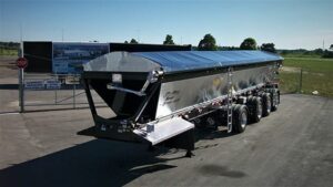 Black Trison Side Roll Tarp on Trail King Red River Live bottom trailer